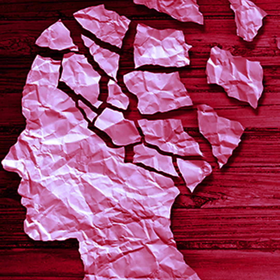 Silhouette profile of a woman's face made from scraps of torn paper