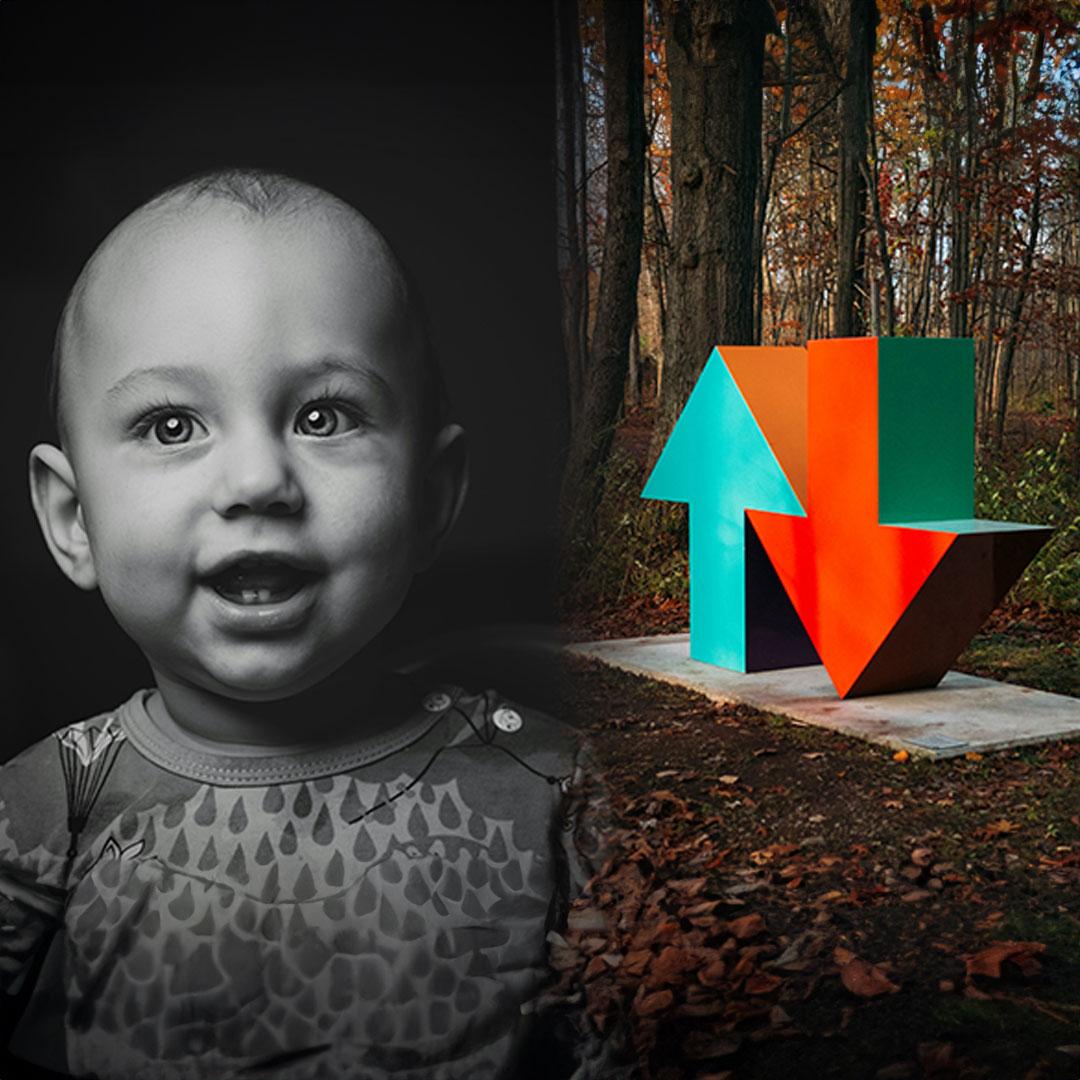 Montage with a wide-eyed, smiling baby and a colorful sculpture composed of one arrow pointing up and another pointing down.